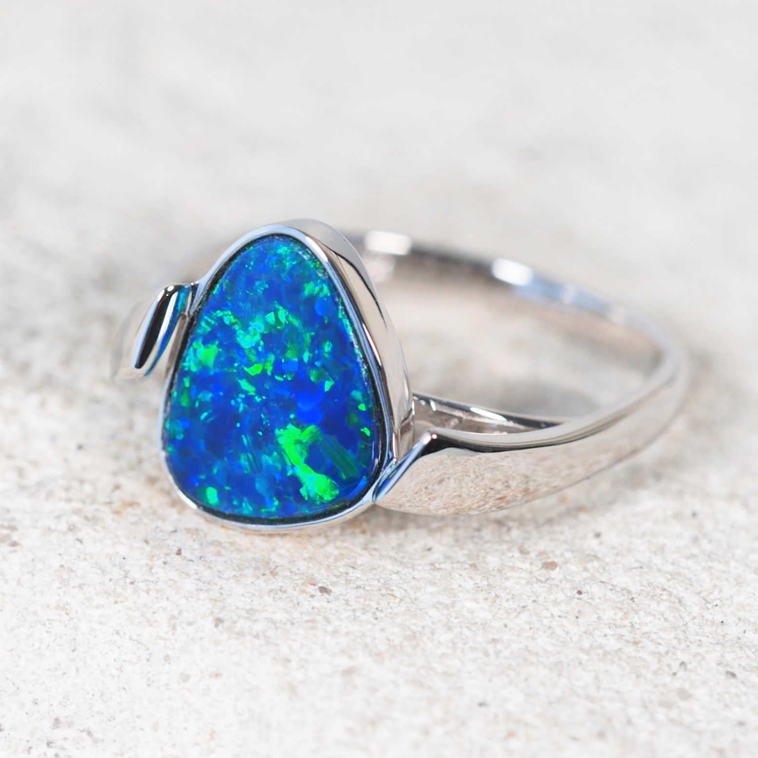 Blue and green opal jewellery – triangular Australian doublet opal set in 14ct white gold