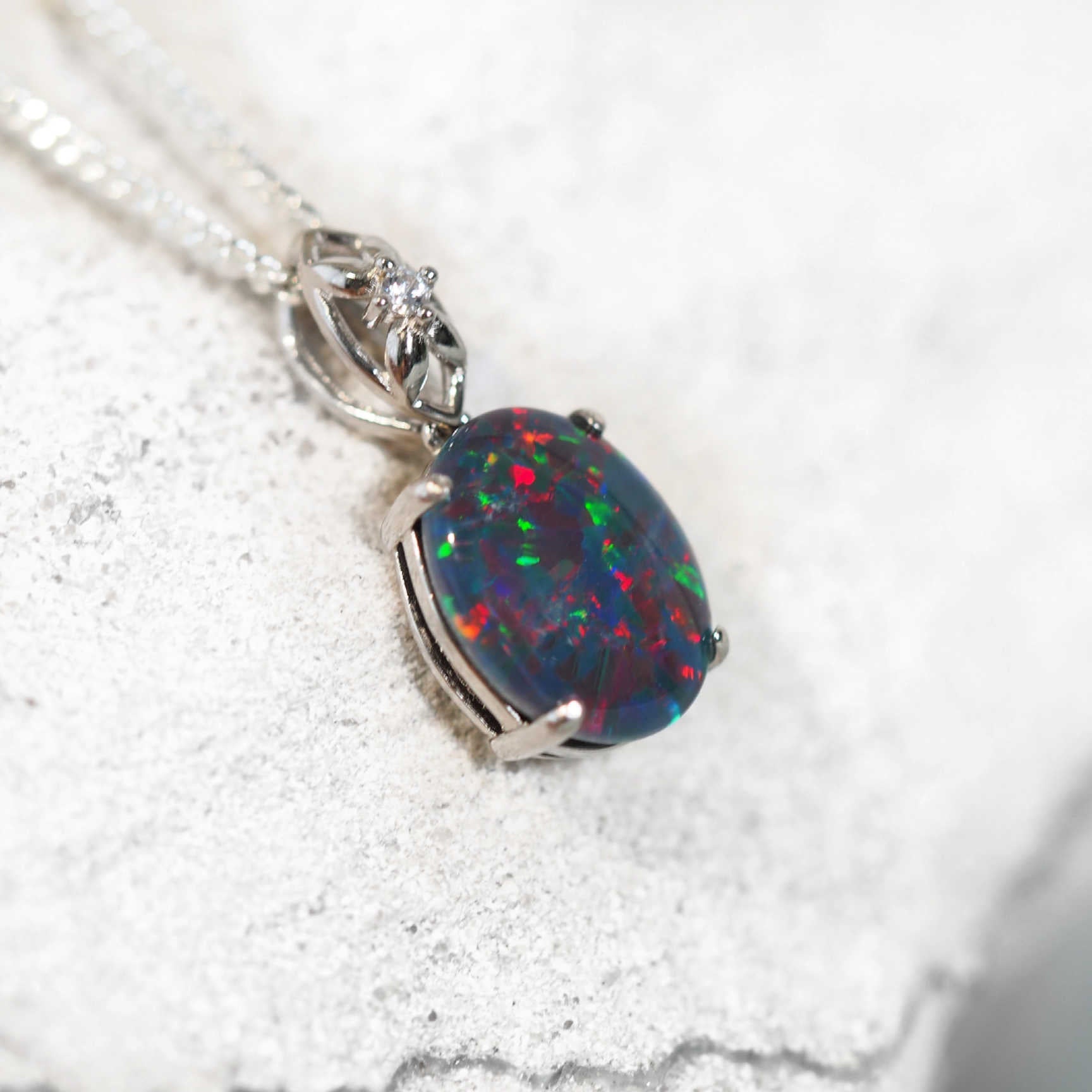 decorative opal pendant set in silver