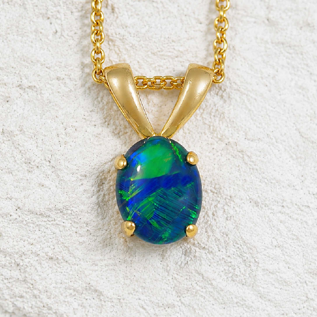 blue and green opal pendant set in gold plated silver