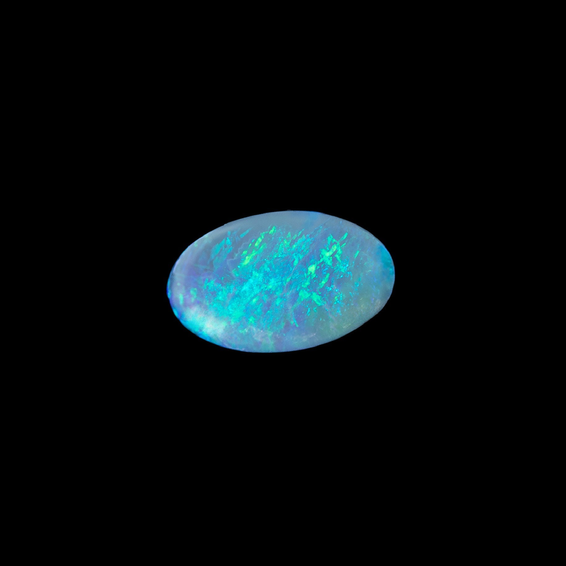 Semi-black Lightning Ridge opal with vivid blue and green flashes