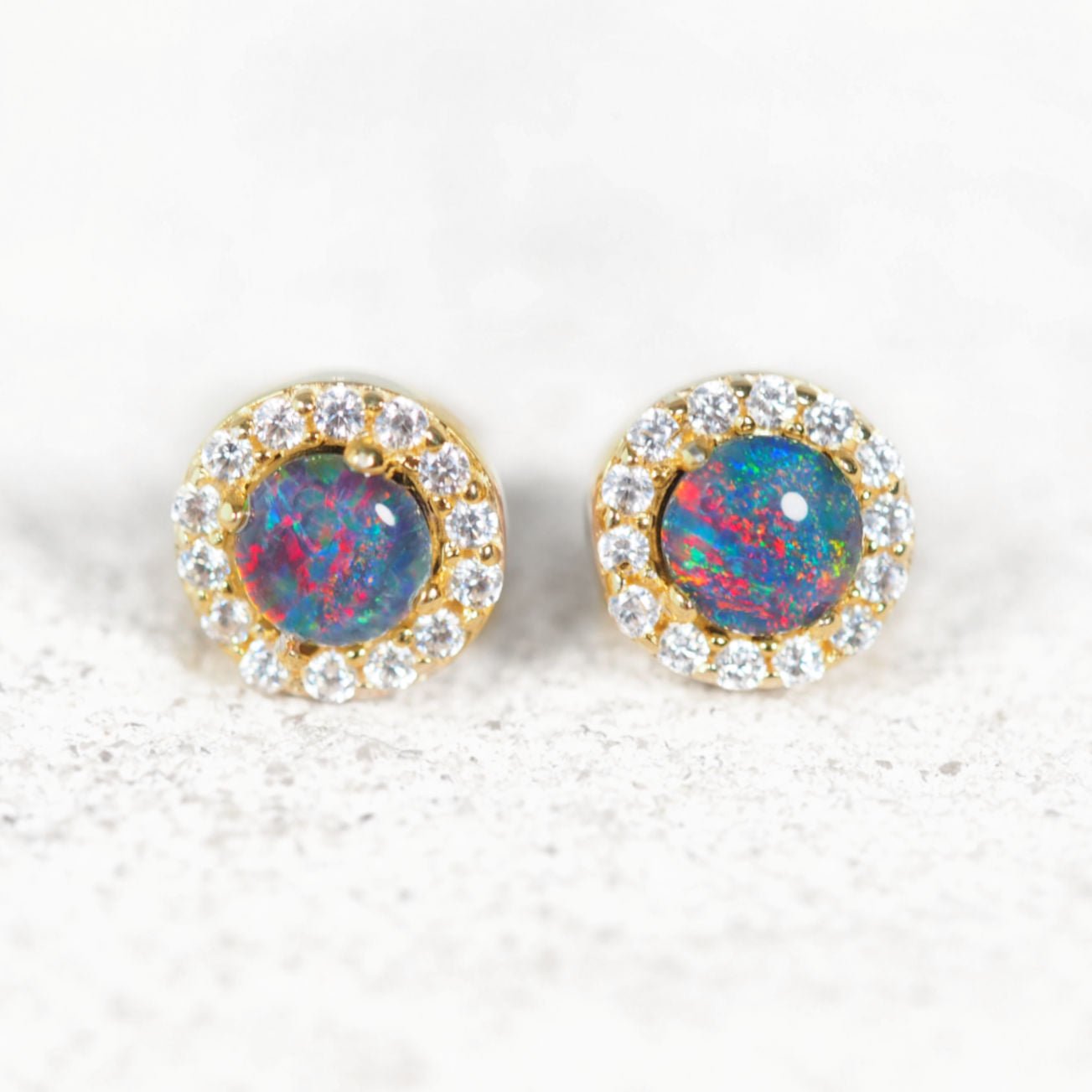 colourful opal stud earrings set in gold plated silver with sparkles