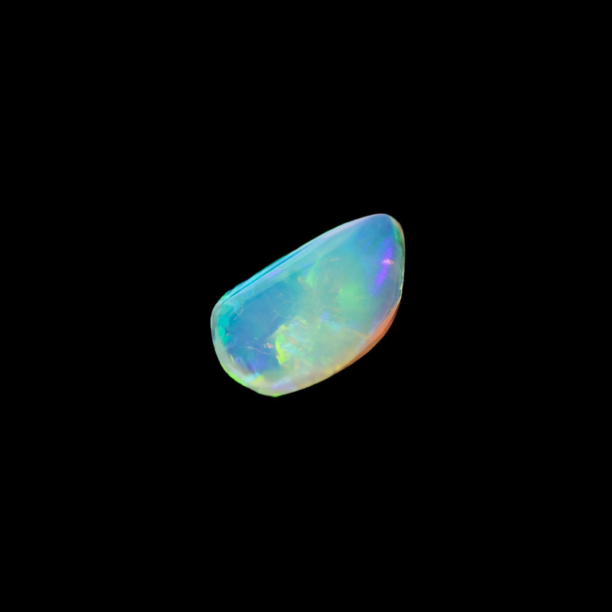 Ethically sourced Lightning Ridge crystal opal shaped into a flame, with a dazzling play of colours