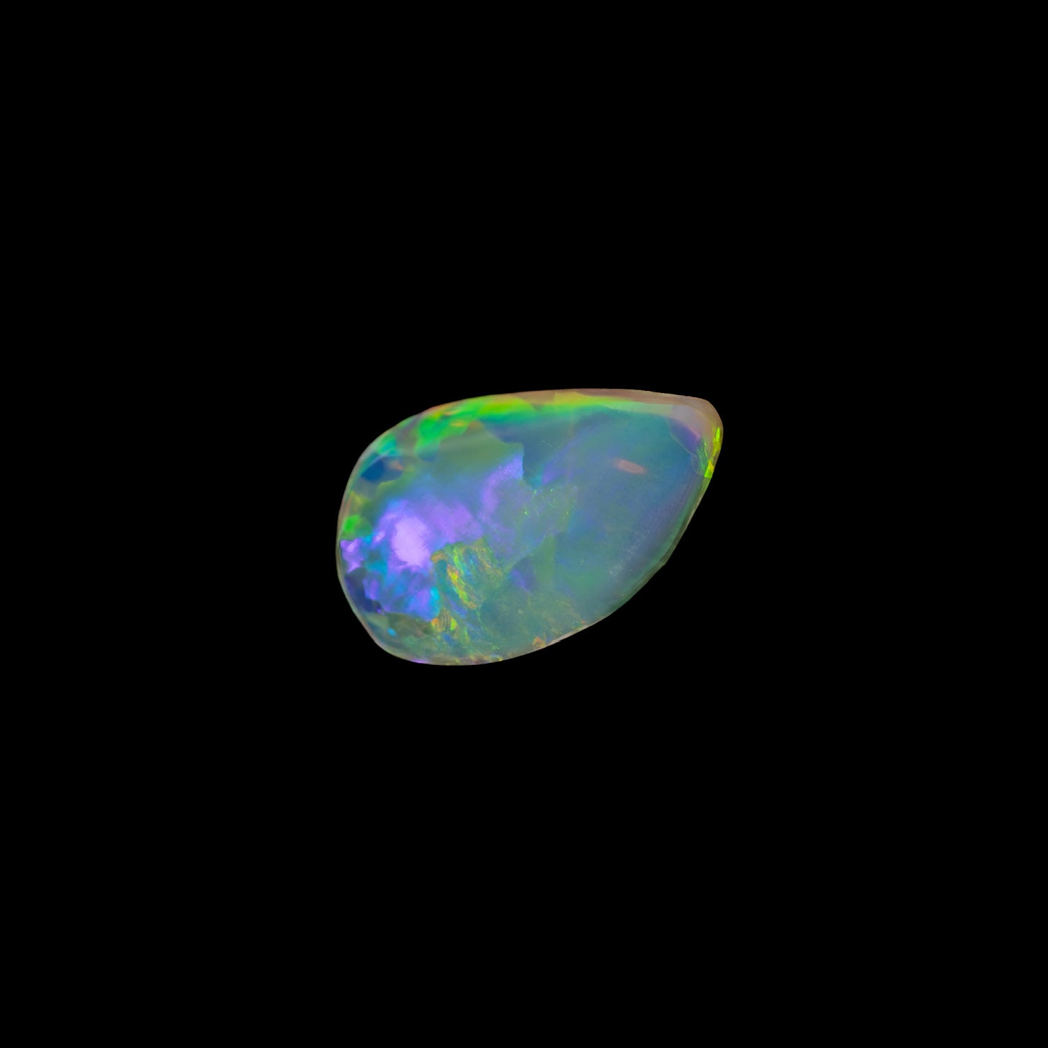 Freeform flame-shaped crystal opal from Lightning Ridge, showcasing vivid multi-colours and a transparent body tone