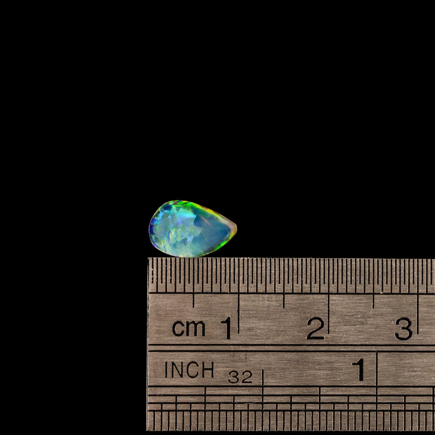 Unique flame-shaped opal from Lightning Ridge, featuring electric multi-colour flashes and transparent brillianc