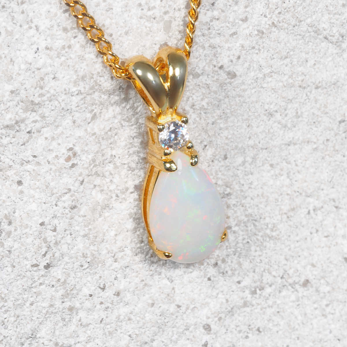 White opal gold plated silver pendant with chain and diamante