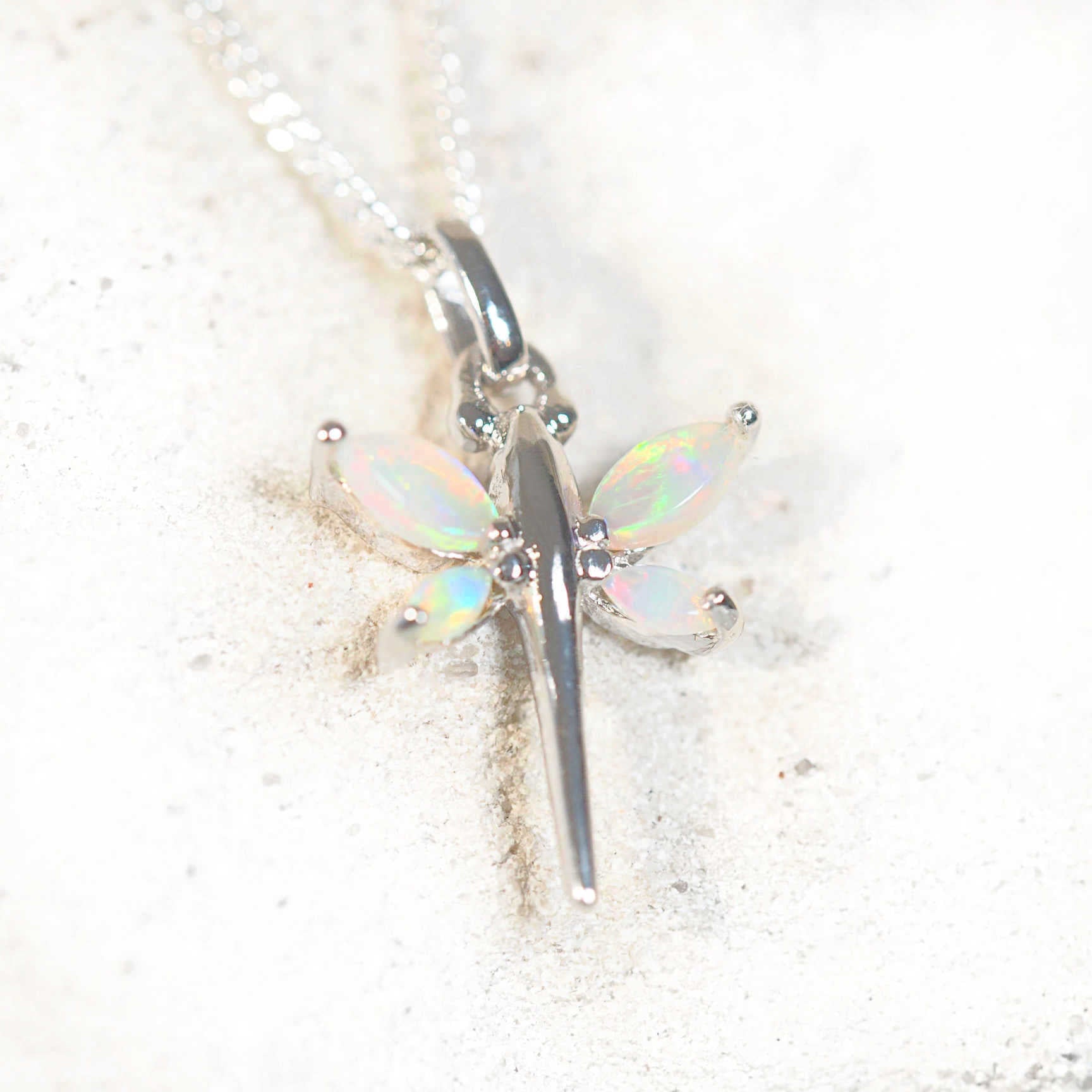 colourful marquise shaped opals set into a dragonfly pendant