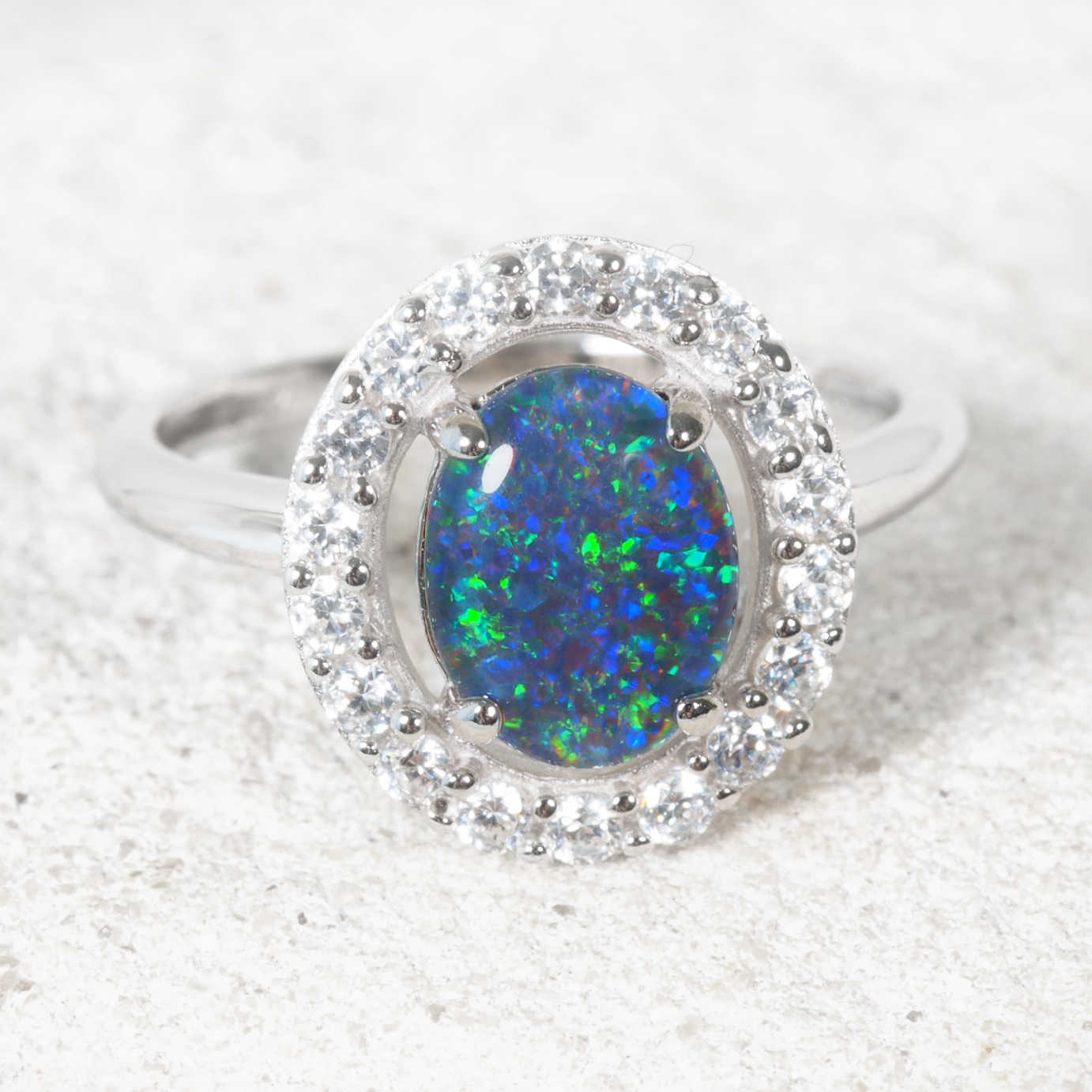 Blue opal ring set with a halo of diamantes