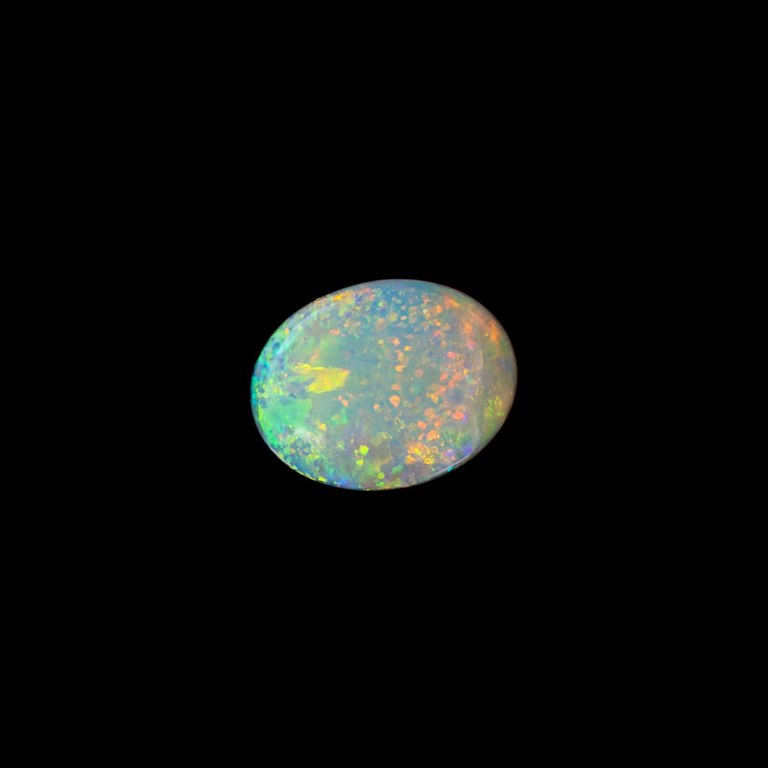 Solid Australian opal stone on a black background