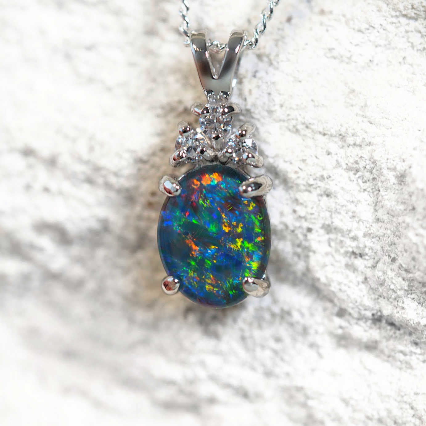 'Trinity Midi' opal pendant in sterling silver with claw-set oval Australian triplet opal and three sparkling cubic zirconias