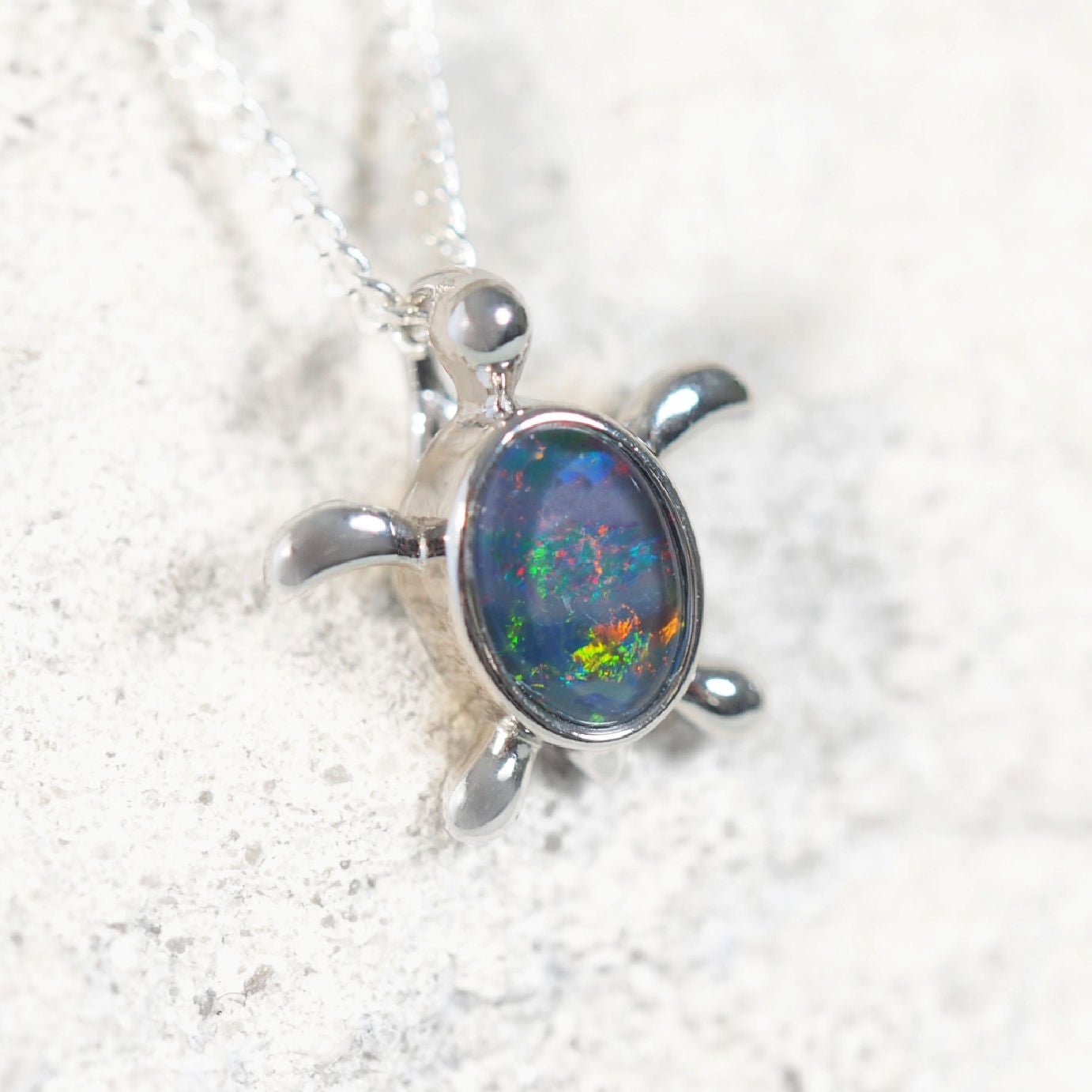 Sterling silver turtle design opal necklace pendant featuring vivid multi-coloured oval Australian triplet opal