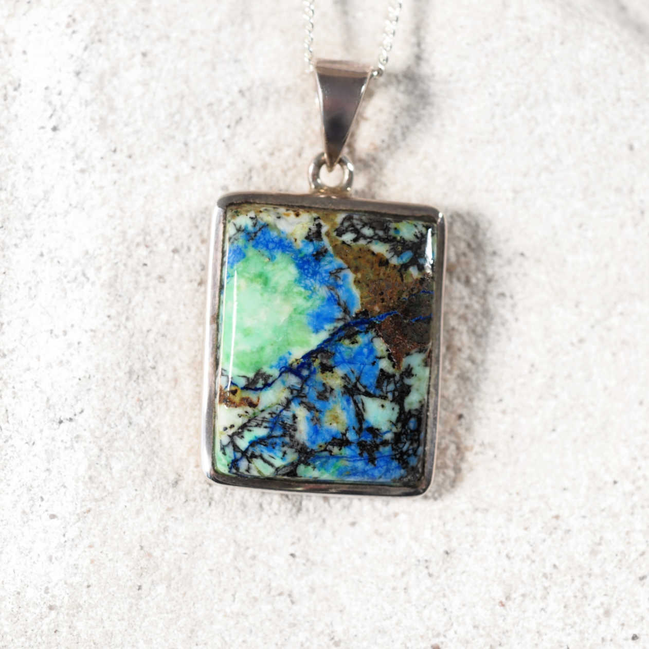 'Una' pendant with square Azurite/Chrysocolla stone set in silver, showing vibrant blue and green tones