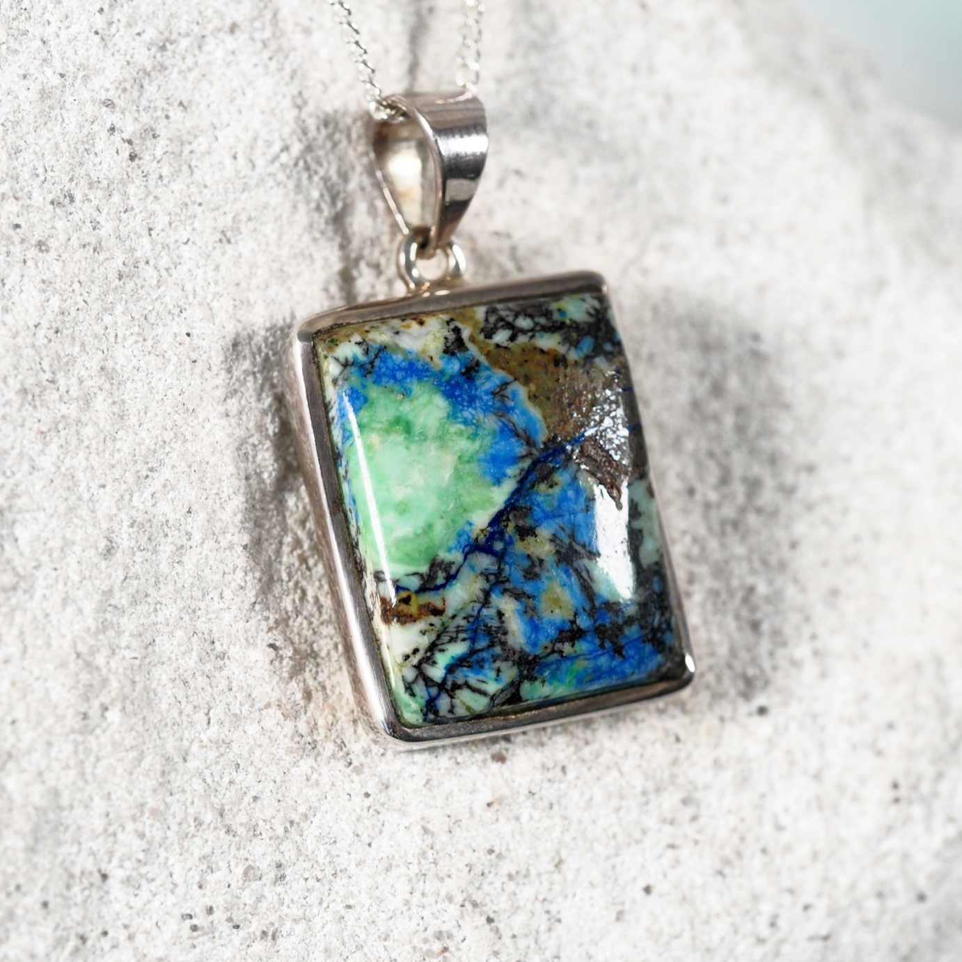 Close-up of 'Una' Azurite/Chrysocolla pendant highlighting the stone’s color and silver frame