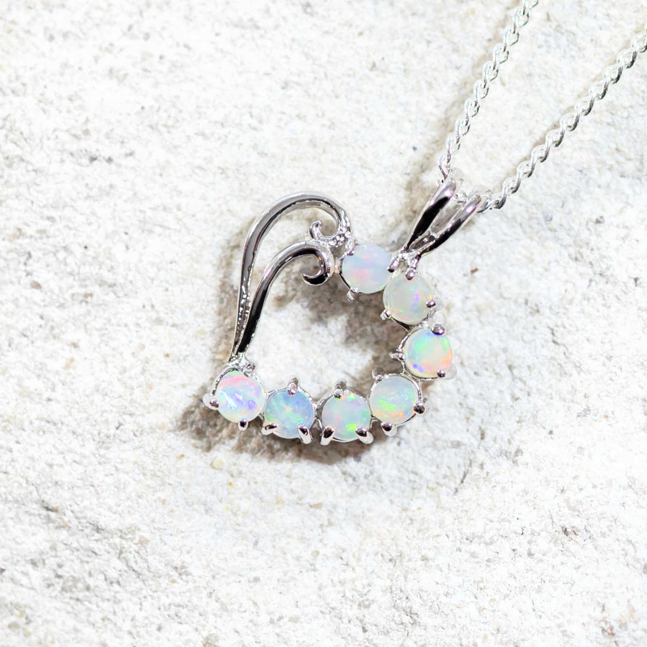 heart design opal necklace featuring seven gemstones