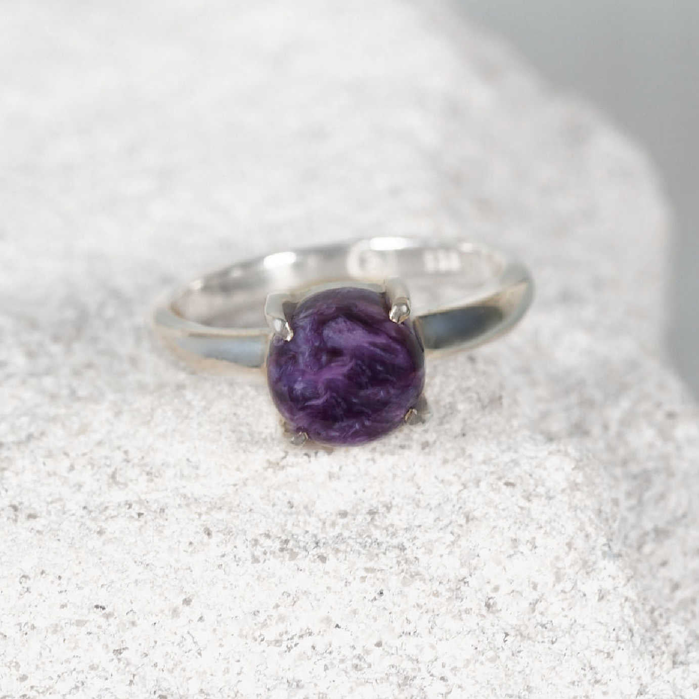 Small silver Charoite ring featuring a round purple gemstone with delicate white and lavender marbling