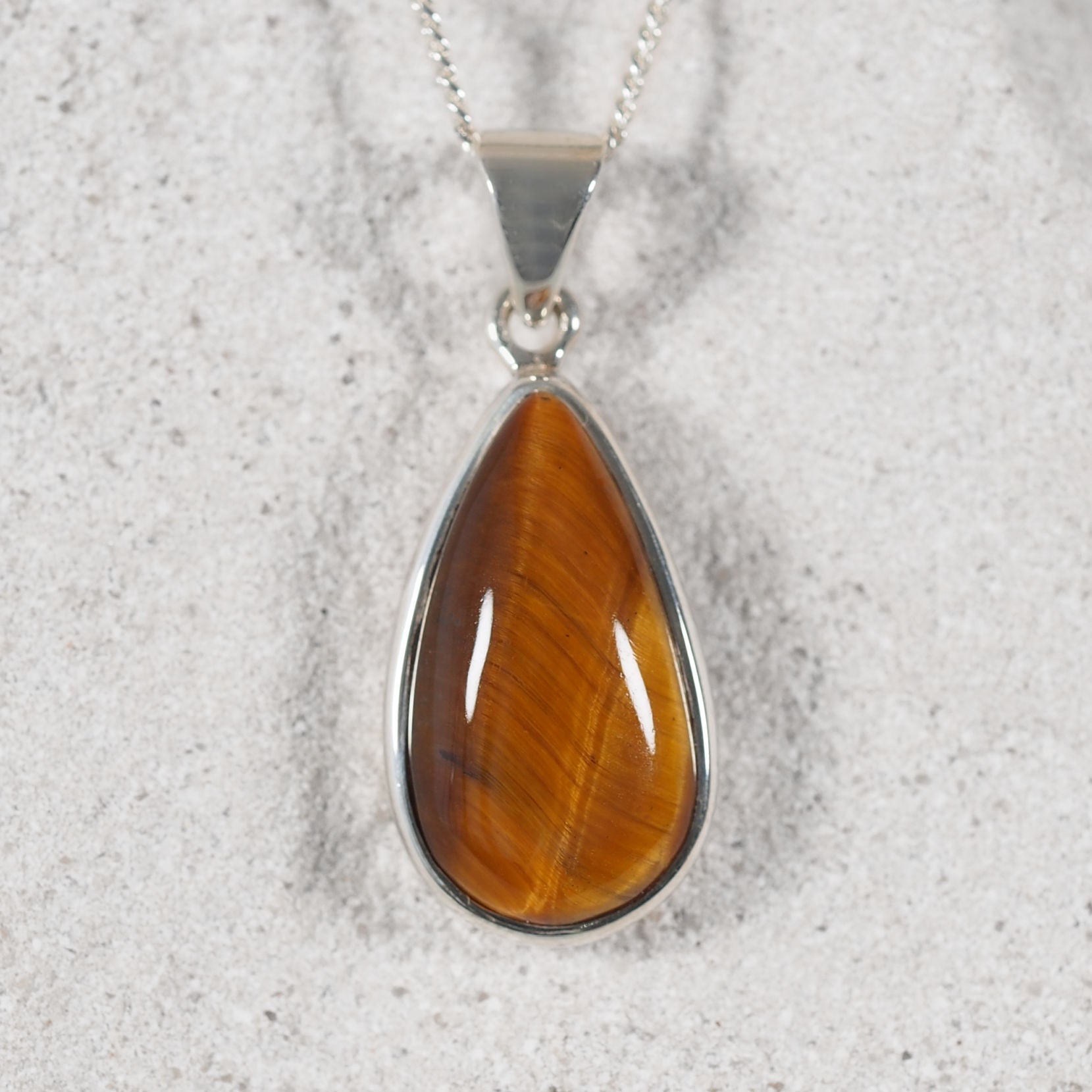 teardrop style tiger-eye pendant with silky sheen