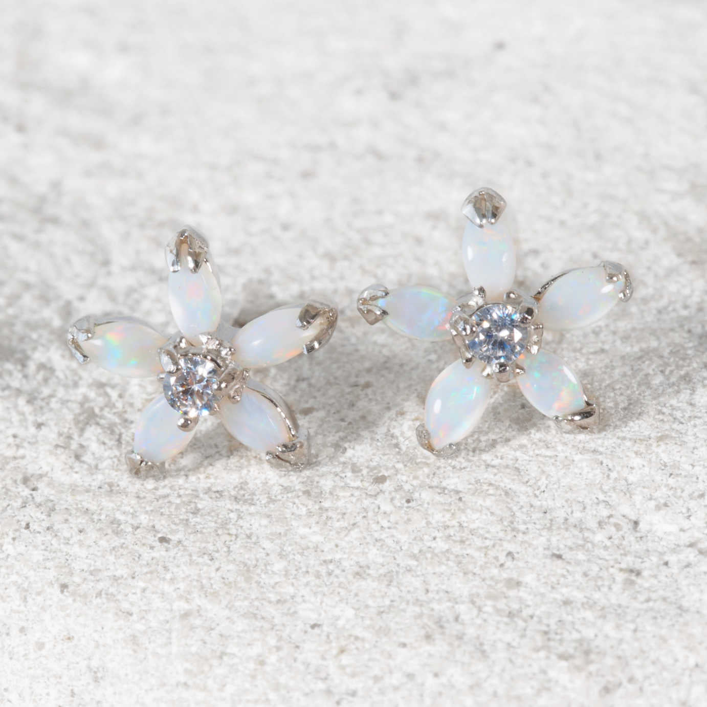 Close-up of 'Yasmin' opal earrings showcasing five marquise-shaped Australian opals in a floral design.