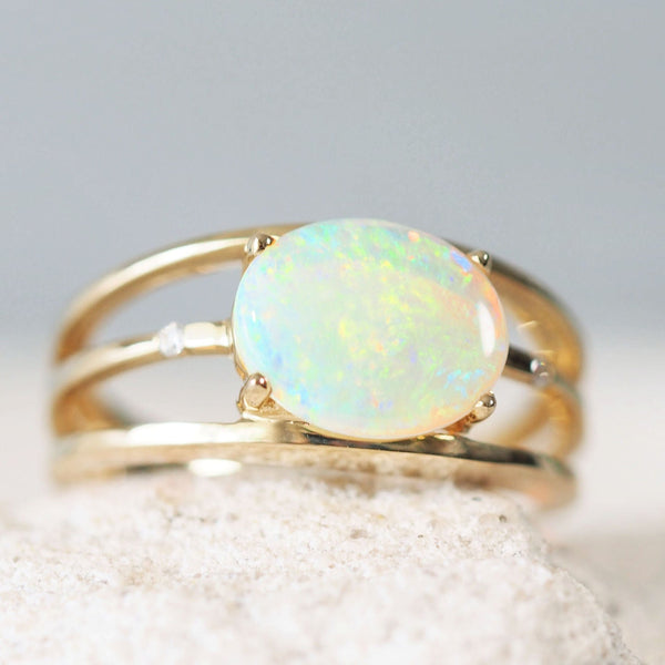gold tri-band opal ring set with a beautiful green crystal opal