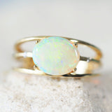 green crystal opal ring set with 14ct gold and two diamonds in a tri band