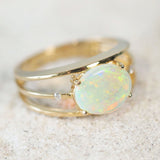 oval Australian crystal opal set in 14ct gold tri-band ring