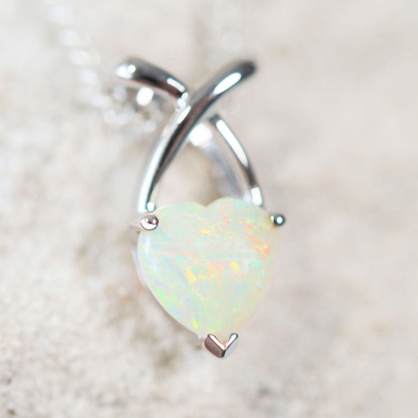 colourful crystal opal heart shaped set into a white gold pendant