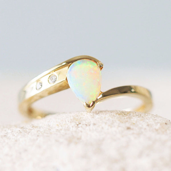 crystal opal ring set in 14ct gold featuring a colourful Australian solid opal