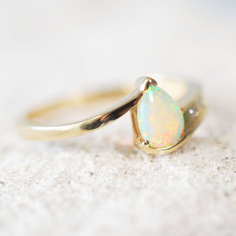 colourful Australian crystal opal gold ring with two sparkling diamonds