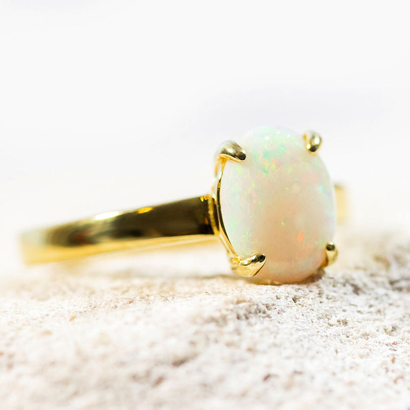 colourful white opal ring set in gold plated silver in a classic design