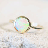green and blue Australian opal gold ring with a diamond