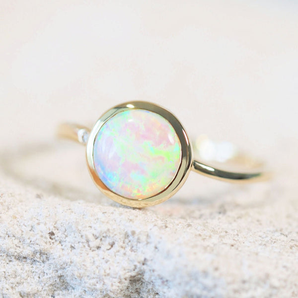 green and blue Australian opal gold ring with a diamond