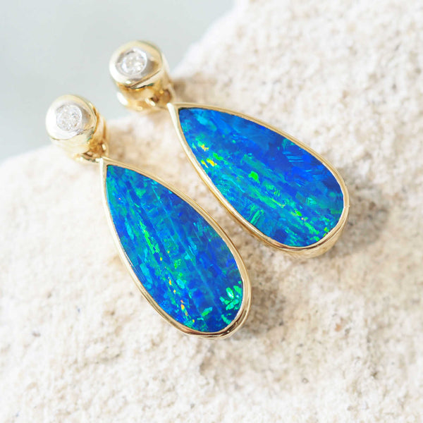 green and blue doublet opal gold earrings with two sparkling diamonds