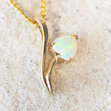 elegant heart shaped crystal opal gold pendant