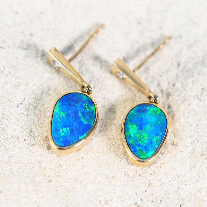 blue and green opal earrings set in 14ct gold with diamonds
