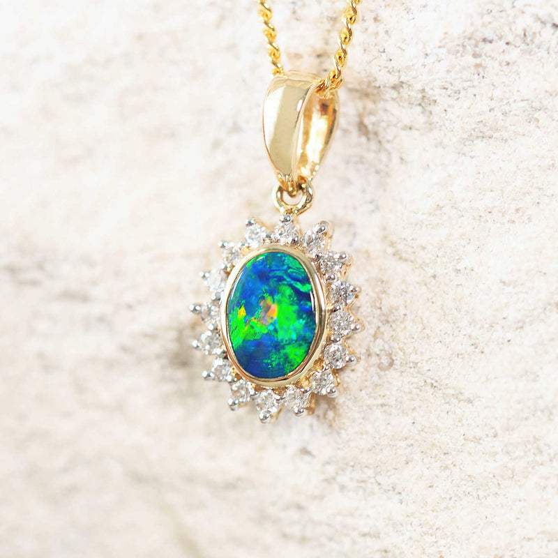 green and blue oval doublet opal gold necklace with 16 diamonds