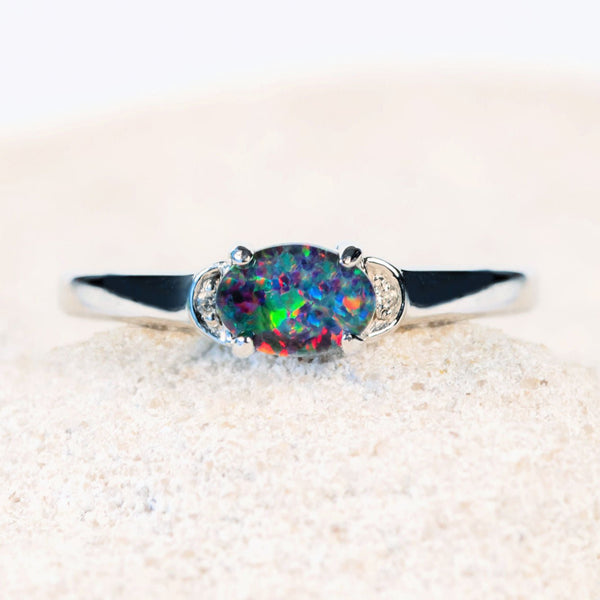colourful oval australian opal ring set with a triplet opal and two cubic zirconias