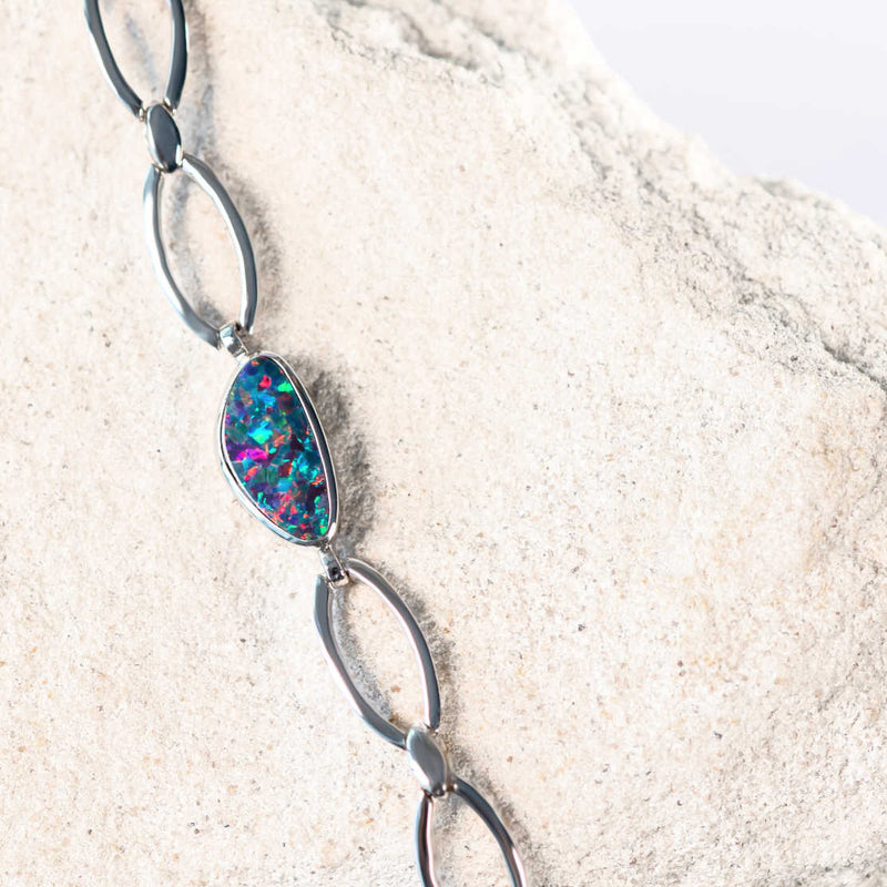 multi-coloured Australian doublet opal set into a sterling silver bracelet