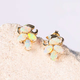 gold opal earrings each set with four crystal opals
