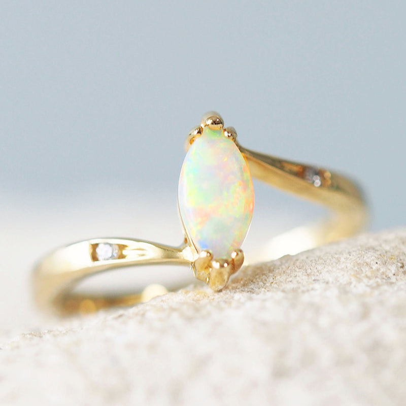 Colourful crystal opal ring set with a marquise shaped Australian opal