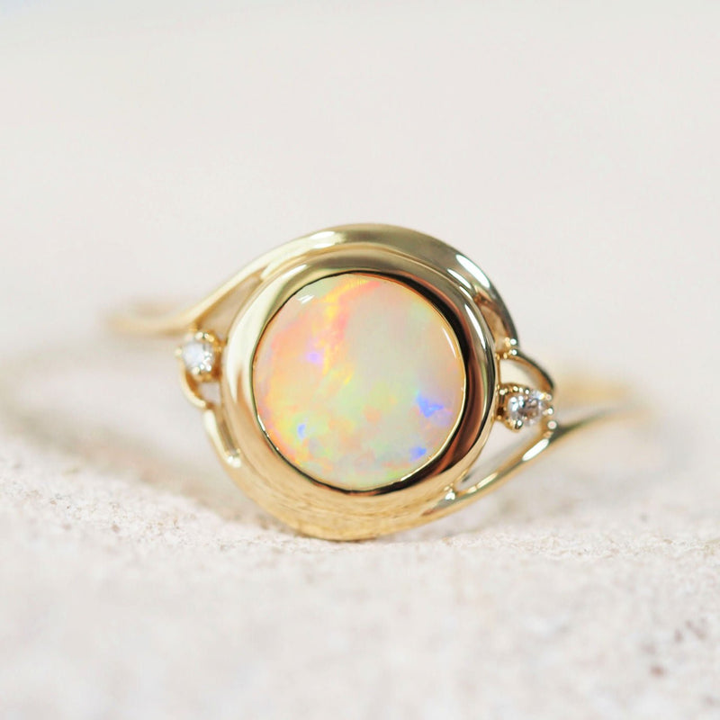colourful lightning ridge opal gold ring with two diamonds