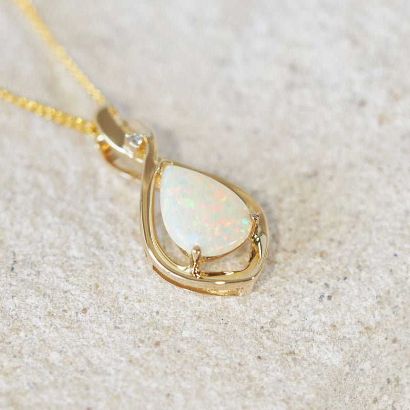 multi-colour white opal teardrop shaped pendant in gold
