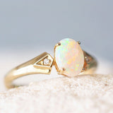 oval australian crystal opal gold ring set with a colourful solid opal
