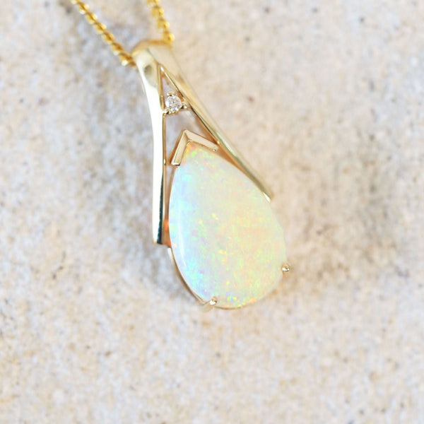 mutli-colour floral patterned white opal pendant set in gold
