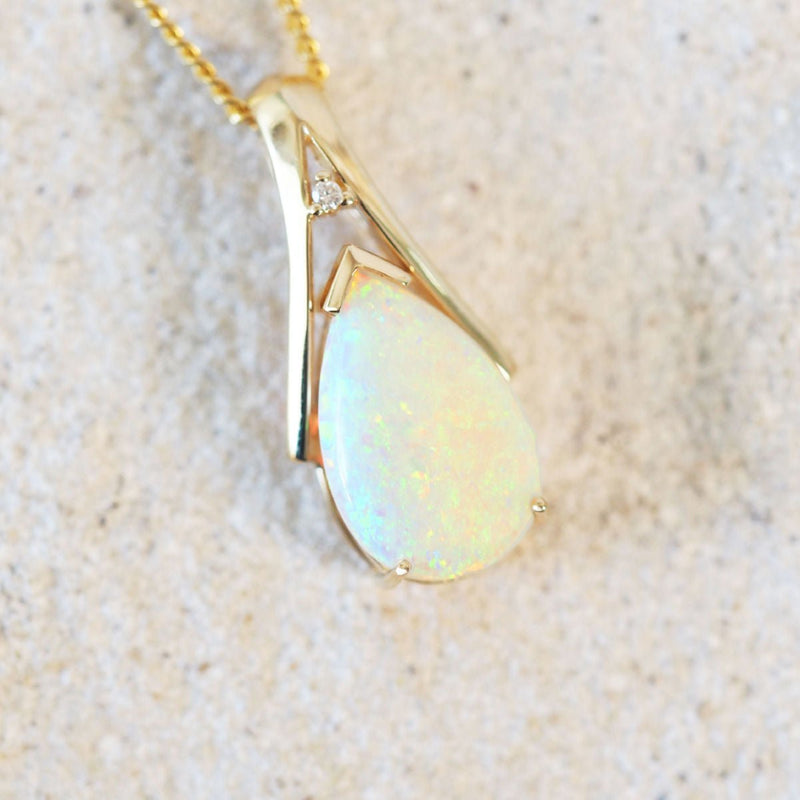 mutli-colour floral patterned white opal pendant set in gold