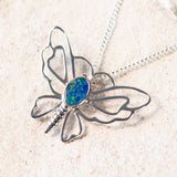 silver butterfly design pendant set with a colourful doublet opal