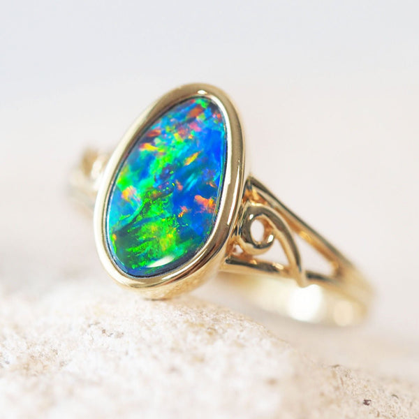 green blue and red doublet opal ring in gold