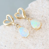 opal earrings set with teardrop shaped crystal opals set in 14ct gold