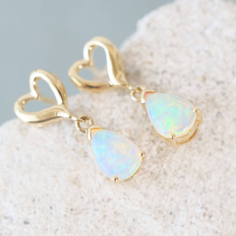 opal earrings set with teardrop shaped crystal opals set in 14ct gold