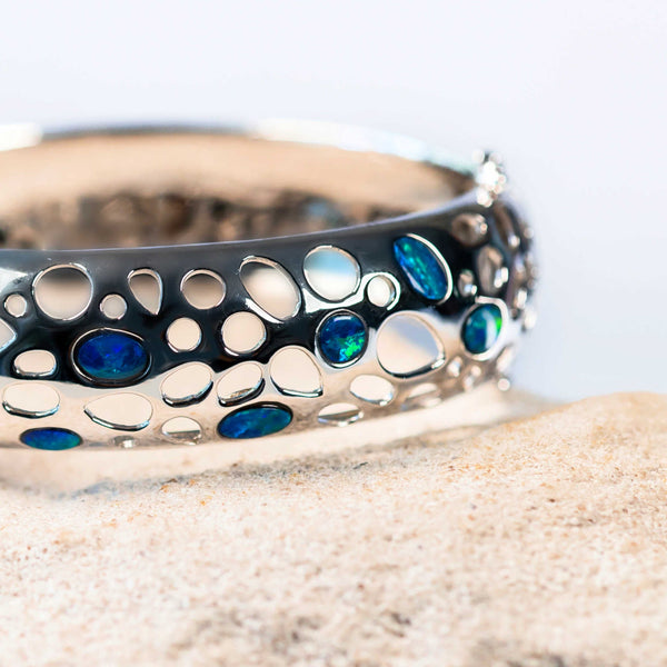 silver opal bangle set with blue and green doublet opals