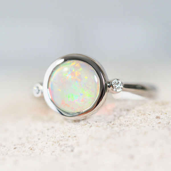 colourful crystal opal white gold ring with two diamonds 