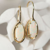 colourful long-oval australian opal earrings set in gold with diamonds