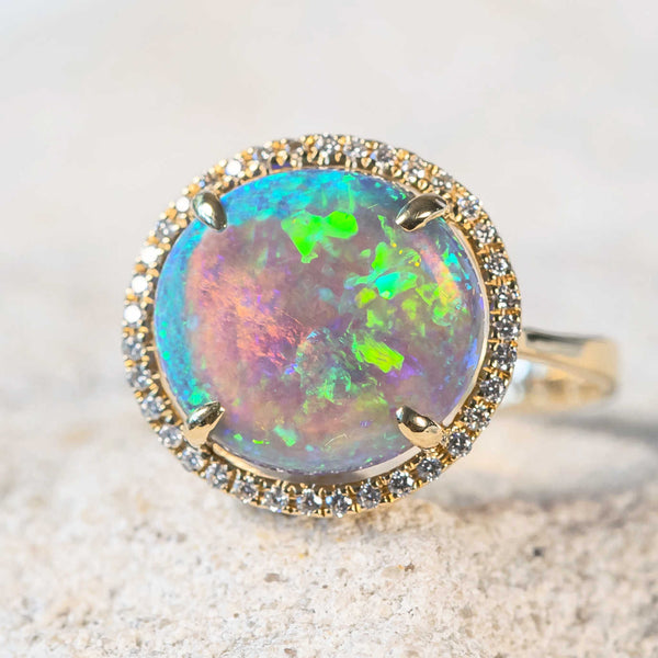 green and blue with yellow highlights crystal opal ring set in 18ct gold with 36 diamonds